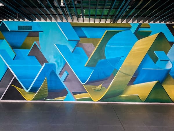 Detail of a wall decoration representing intersecting blue and green ribbons in a sophisticated geometrical pattern. Aerosol art by Dado.
