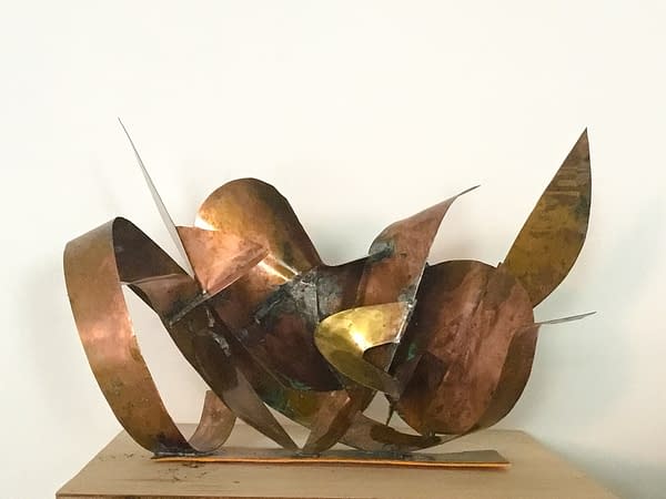 A sculpture made of bent and torched copper ribbons in original copper color with slightly different copper tones and some oxidation stains, front view. Artwork by Dado