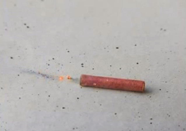 A little firecracker given as a souvenir gadget with the exhibition catalogue