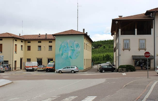 Sfera fiocco di neve by Dado artwork on wall in Cles - aerosol art - wide location street view
