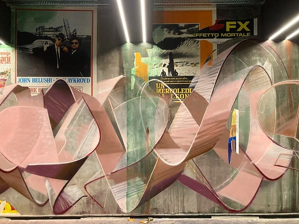 Detail of torn paper posters as a part of a decorated garage interior walls recreating a street underground atmosphere. Artwork by Dado.