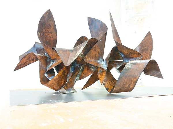 Sculpture made of bent and torched copper ribbons in original copper color with some oxidation stains and welding marks. Artwork by Dado